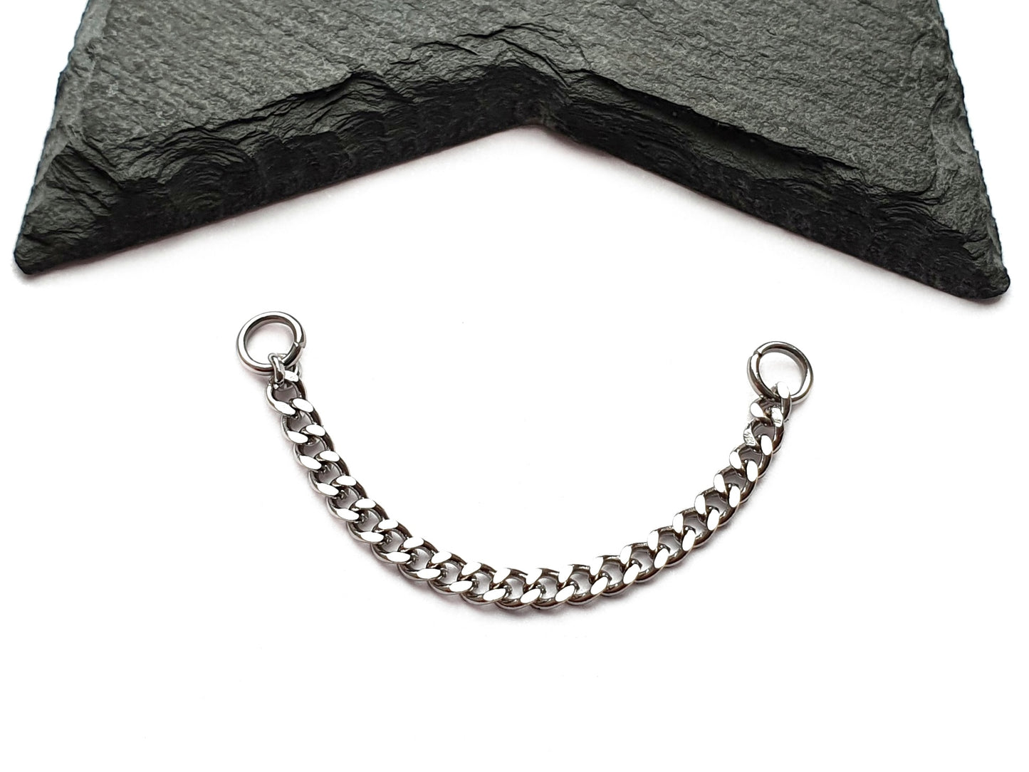 Stainless steel curb chain ear jacket