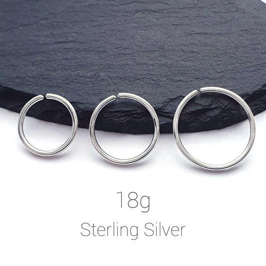 18g silver hoop helix piercing